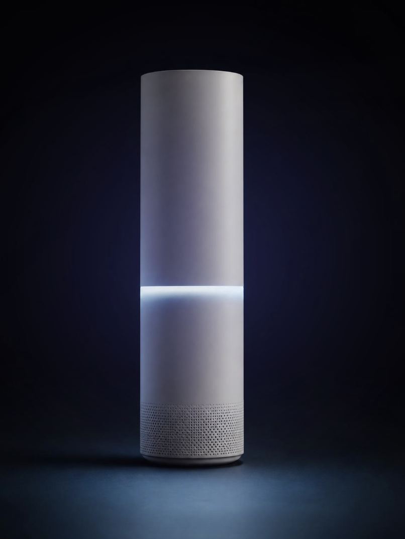 IntelliLight, a matte cylindrical desktop device with an integrated luminous band and discreet audio base